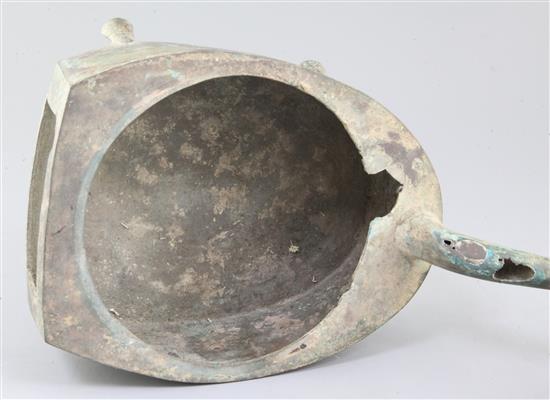 A Chinese archaic bronze steamer vessel, in two parts, Xian, Han dynasty, 206 B.C.-220 A.D., 30cm long, holes